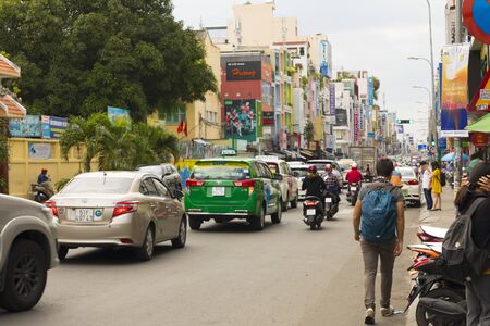 Street view of Ho Chi Minh with unidentified local Vietnamese people commute on the road in Ho Chi Minh City, Vietnamのeditorial素材