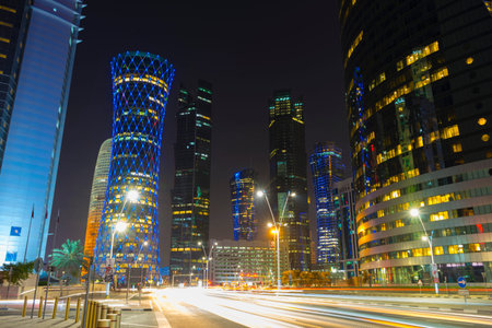 Night urban skyline of modern skyscrapers in Financial District in Doha, Qatar