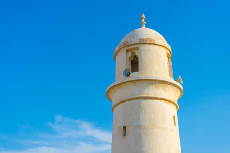 Al Ahmad Mosque, ancient mosque with its minaret in the heart of Souq Waqif, old traditional market in Doha, Qatarのeditorial素材