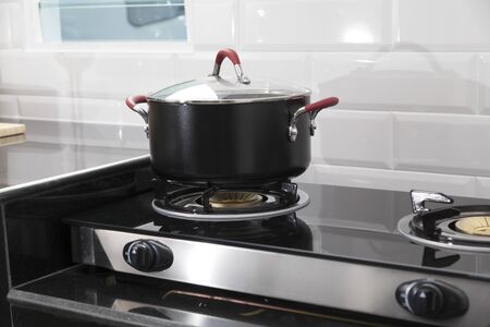 Metal Pot on induction hob in modern kitchen.の写真素材