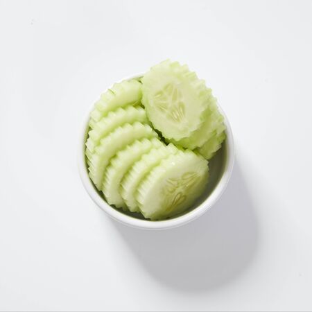 Sliced cucumber isolated on white.の写真素材