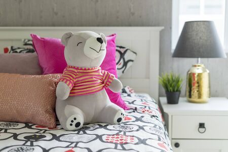 Children bedroom with pink pillows. Bed for baby or toddler girl at home.の写真素材