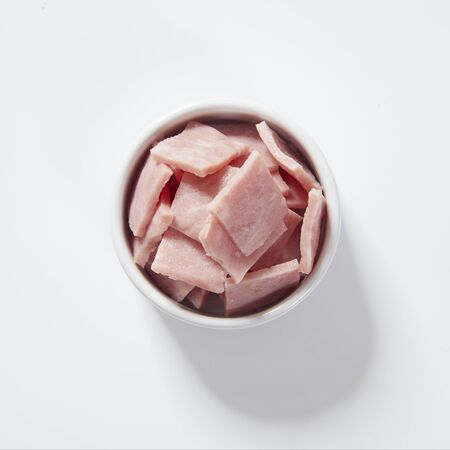 pork ham slices isolated on white backgroundの写真素材