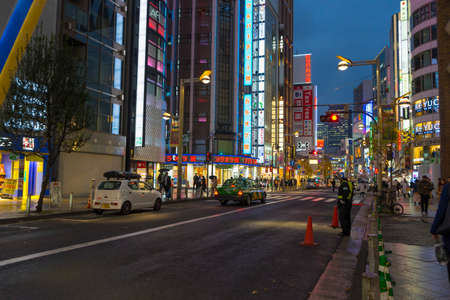 View of street and cityscape at night with colorful advertisement billboard light in Shinjuku district in Tokyo, Japanのeditorial素材