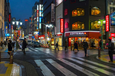 View of street and cityscape at night with colorful advertisement billboard light in Shinjuku district in Tokyo, Japanのeditorial素材