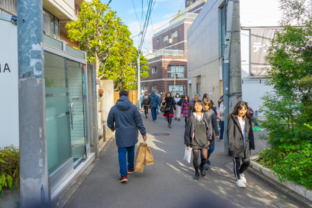 Crowd of people walking and shopping on Takeshita Street in Harajuku in Tokyo, Japan