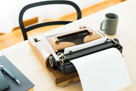 Old typewriter on the table with nobody, concept of working at homeの写真素材
