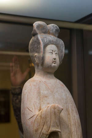 Old and vintage ceramic vase and statue of Chinese art on display in museum.のeditorial素材