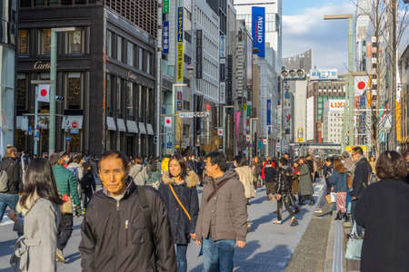 people walking and relaxing on Ginza street in Tokyo, Japanのeditorial素材