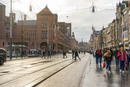 Many people on Damrak street in Amsterdam.のeditorial素材