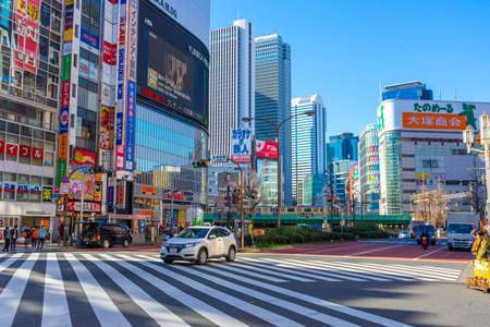 Street view of building and sign board of Shinjuku ward in Tokyo, Japanのeditorial素材