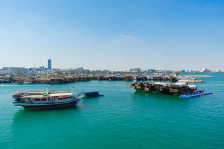 Traditional boats called Dhows are anchored at Dhow Harbour in Doha, Qatarのeditorial素材