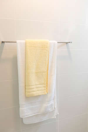 White clean towel hanging on towel rack in the bathroomの写真素材