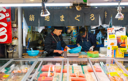 Merchants sell seafood at Tsukiji Fish Market in Tokyo, Japanのeditorial素材