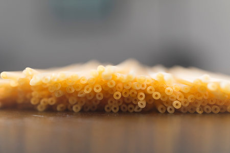 Close up of raw Organic Bucatini Pasta in a Bunchd