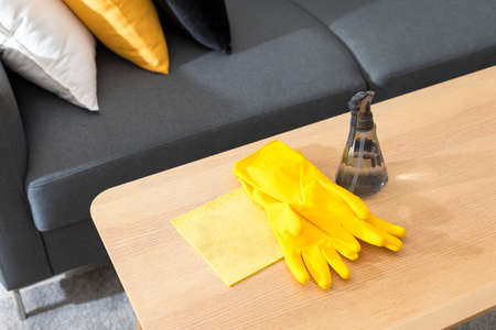 Hand sanitizer antibacterial antiseptic gel, rubber gloves on wooden table. Coronavirus Disease prevention and health protection during flu virus outbreak concept.の写真素材