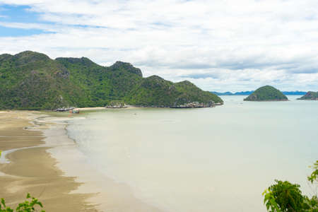 White Sandy Beach of Laem Sala beach which is Flanked On Three Sides By Dry Limestone Hills, Thailand.の写真素材