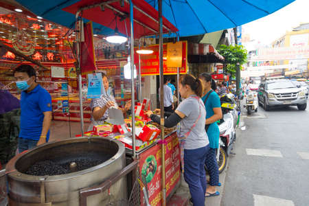 Dried herb and fruit shop with many people in Yaowarat or Chinatown in Bangkok, Thailand.のeditorial素材