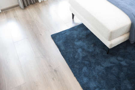 Luxurious dark blue carpet and white sofa in modern living room.の写真素材