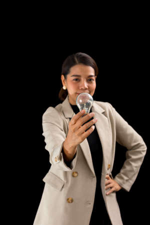 woman holding light bulbs, ideas of new ideas with innovative technology and creativity.の写真素材