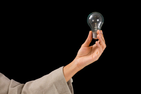 Woman Hands holding light bulb - symbols of idea, creative thinking, innovations and intelligence.