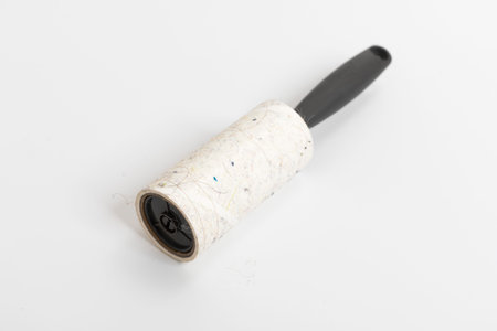 Lint Roller with handle on white background.