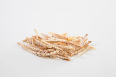 fried taro chips on white background. Thai style homemade healthy sweet snacks.