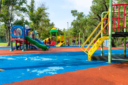 Bangkok, Thailand - April 24, 2022 : Children and family happily have fun at playground in public park in Bangkok, Thailand on April 24, 2022.のeditorial素材