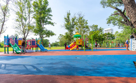 Bangkok, Thailand - April 24, 2022 : Children and family happily have fun at playground in public park in Bangkok, Thailand on April 24, 2022.のeditorial素材