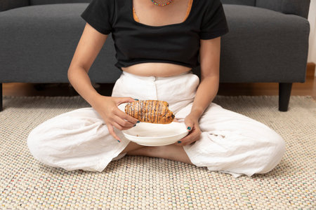 Asian young female checking her waist for excess weight from overeating problem obesity. Healthcare...