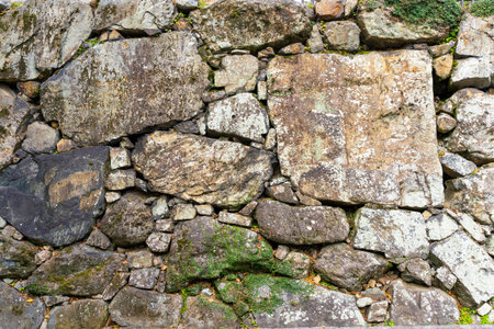 grey old stone background wall of an old buildingの写真素材