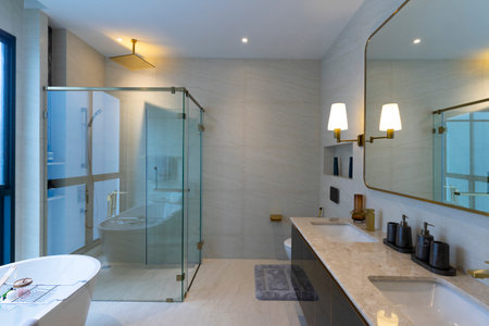 Modern White Marble Bathroom Design with double sinks and shower room.の写真素材