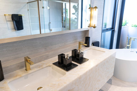 Modern White Marble Bathroom Design with double sinks and shower room.の写真素材