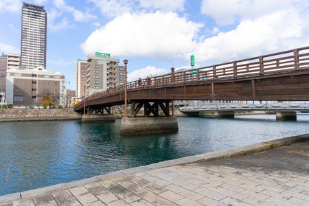 Tokiwa Bridge with blue sky across Murasaki River in Kitakyushu, Japanの写真素材