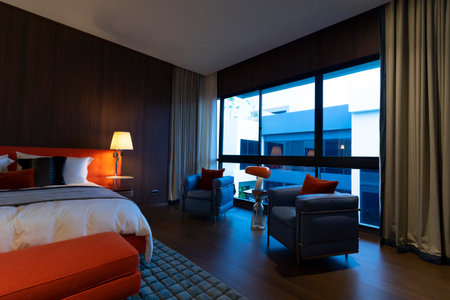 Modern retro bedroom interior with mid century decoration furniture and wall lamp.の写真素材