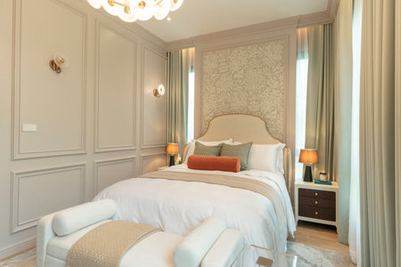 Luxury House with regal elegant bedroom. Bedroom with headboard and chandelier.の写真素材
