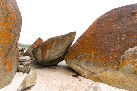 A big red stone at the Squeaky Beach in Wilsons Promontory National Park.の写真素材