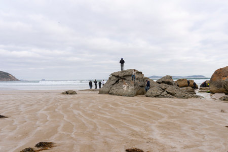 A big red stone at the Squeaky Beach in Wilsons Promontory National Park.の写真素材