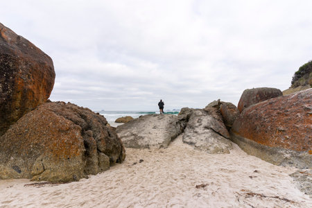 A big red stone at the beach in Wilsons Promontory National Park.の写真素材