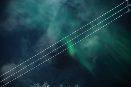 Northern lights explosion above power lines in Rovaniemi, Laplandの写真素材