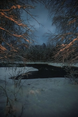 Vikakongas arctic river in snow in polar night in Rovaniemi, Laplandの写真素材