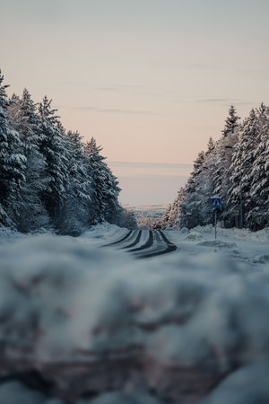 Icy road leading into the Lappish wilderness in winter outside Rovaniemi Laplandの写真素材