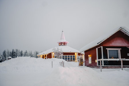 Santa Claus Holiday Village in the snow in winter in Rovaniemi, Laplandの写真素材