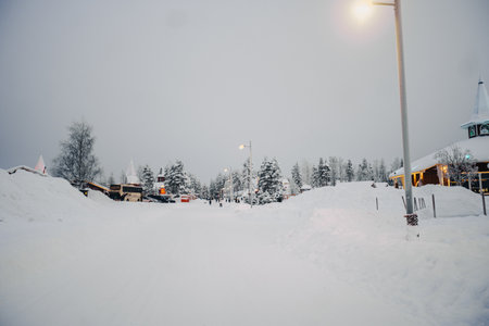 Street with lights to Santa Claus' Village in Rovaniemi, Lapland in winterの写真素材