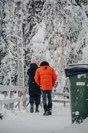 People walking through winter wonderland in Ranua, Laplandの写真素材