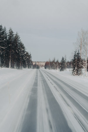 Icy road through the arctic wilderness in Ranua, Lapland