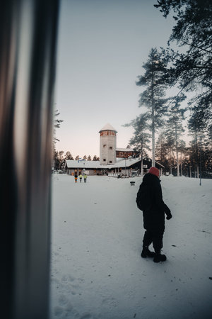 Woman outside entrance to wildlife park in Ranua, Lapland