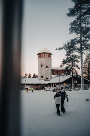 Couple outside entrance to wildlife park in Ranua, Laplandの写真素材