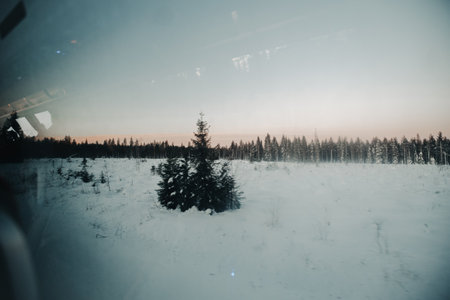 Snowy frozen lake shot from coach window in Ranua, Laplandの写真素材