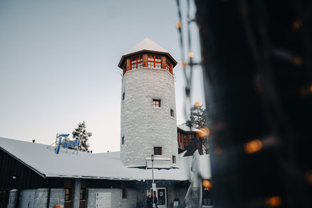 Wildlife park entrance tower behind fairy lights in Ranua, Laplandの写真素材